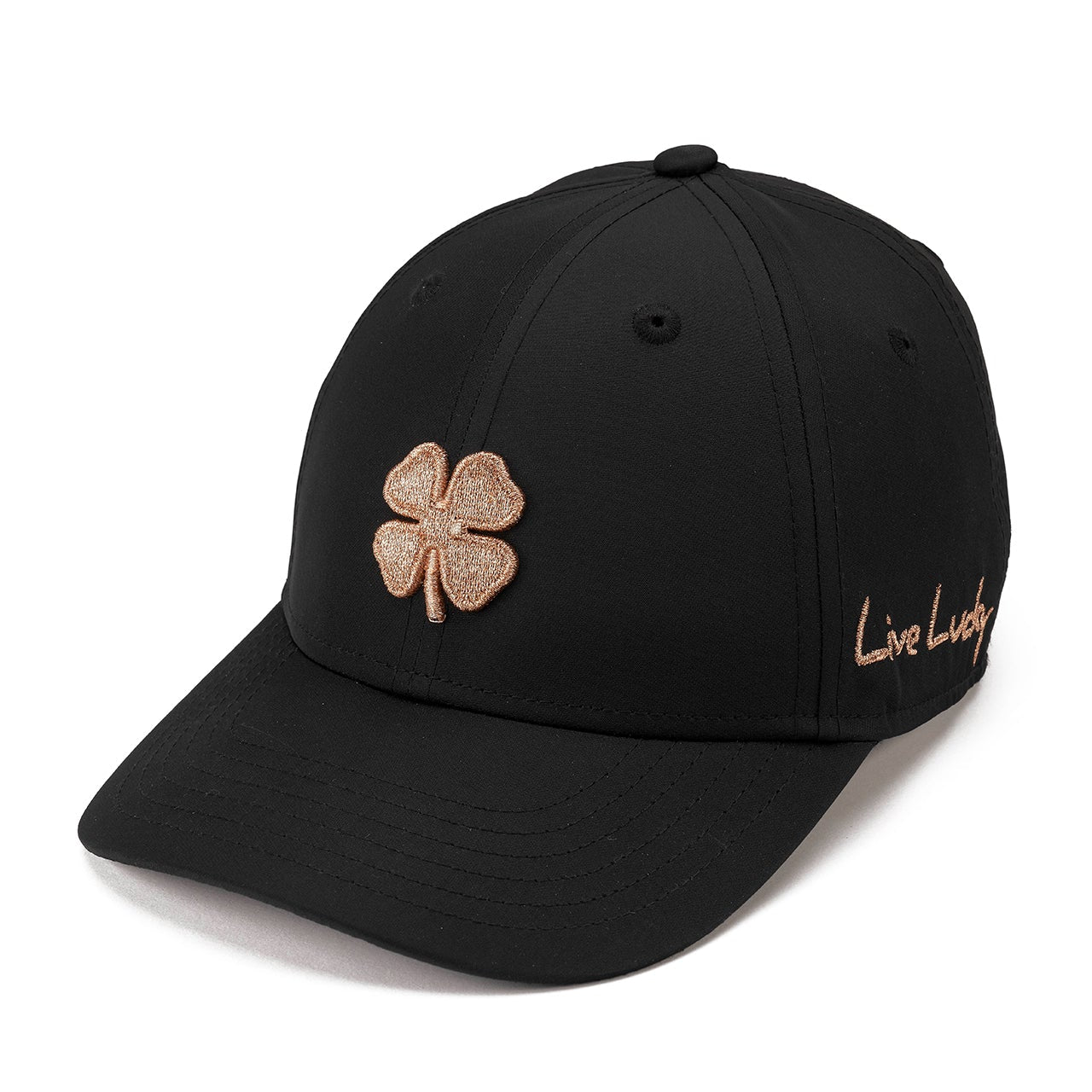 A black baseball cap featuring a glittery rose gold embroidered shamrock on the front and 'Live Lucky' script embroidery on the side, shown against a plain white background.