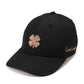 A black baseball cap featuring a glittery rose gold embroidered shamrock on the front and 'Live Lucky' script embroidery on the side, shown against a plain white background.
