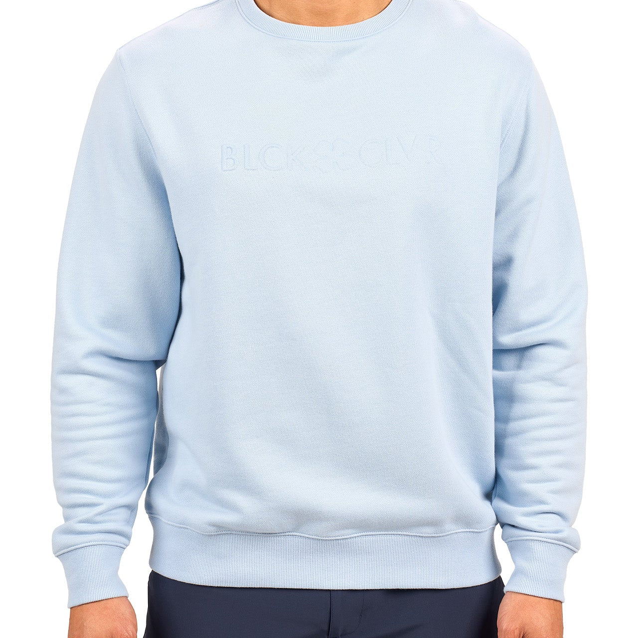 man wearing an light blue colored sweater from Black Clover with a 3d text BLCK CLVR on the chest