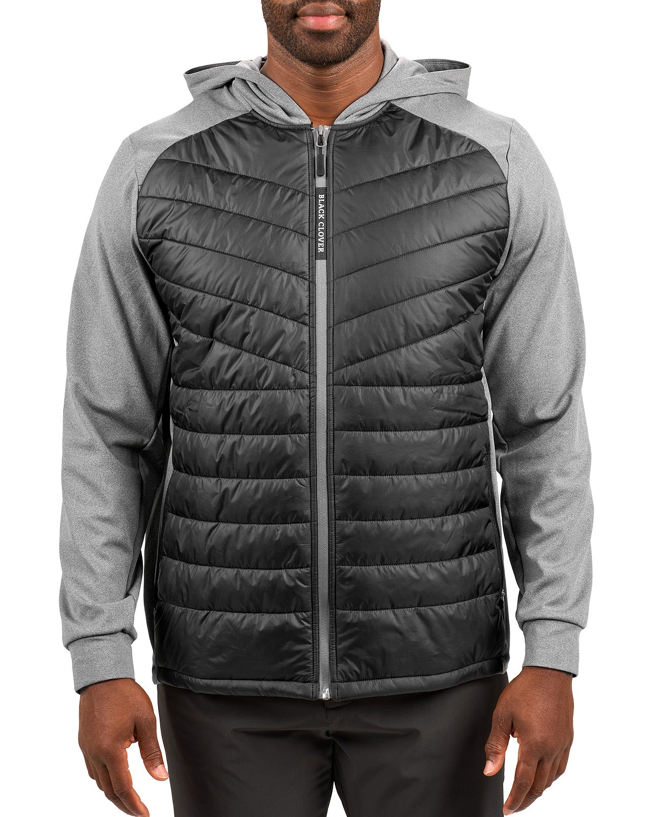 Man wearing black quilted jacket from Black Clover